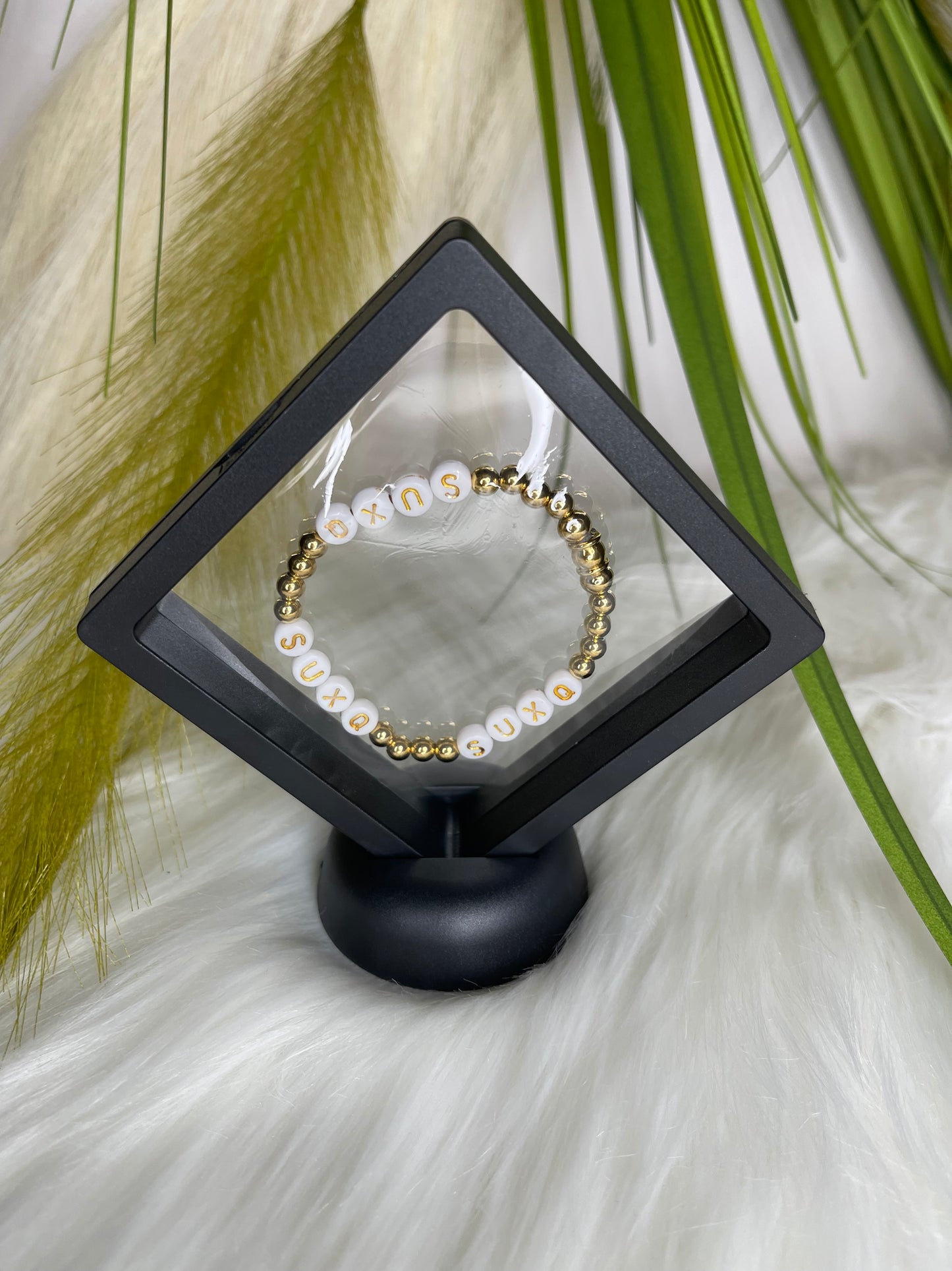 Gold Stainless Steel “SUXQ” Stretch Novelty Bracelet